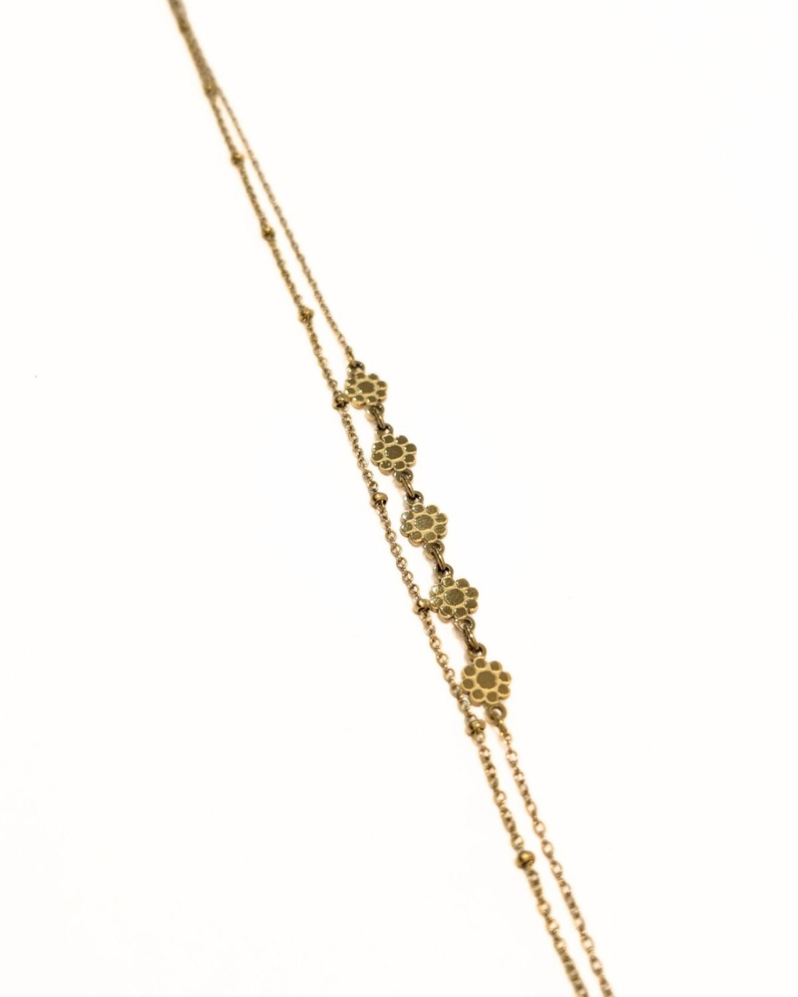 Chaine de cheville acier doré doublé petites fleurs