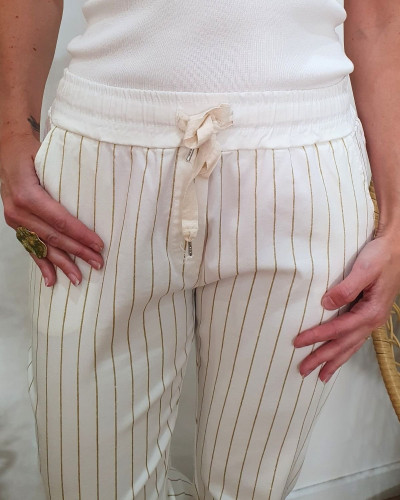 Pantalon femme élastiqué écru rayures dorées pailletées