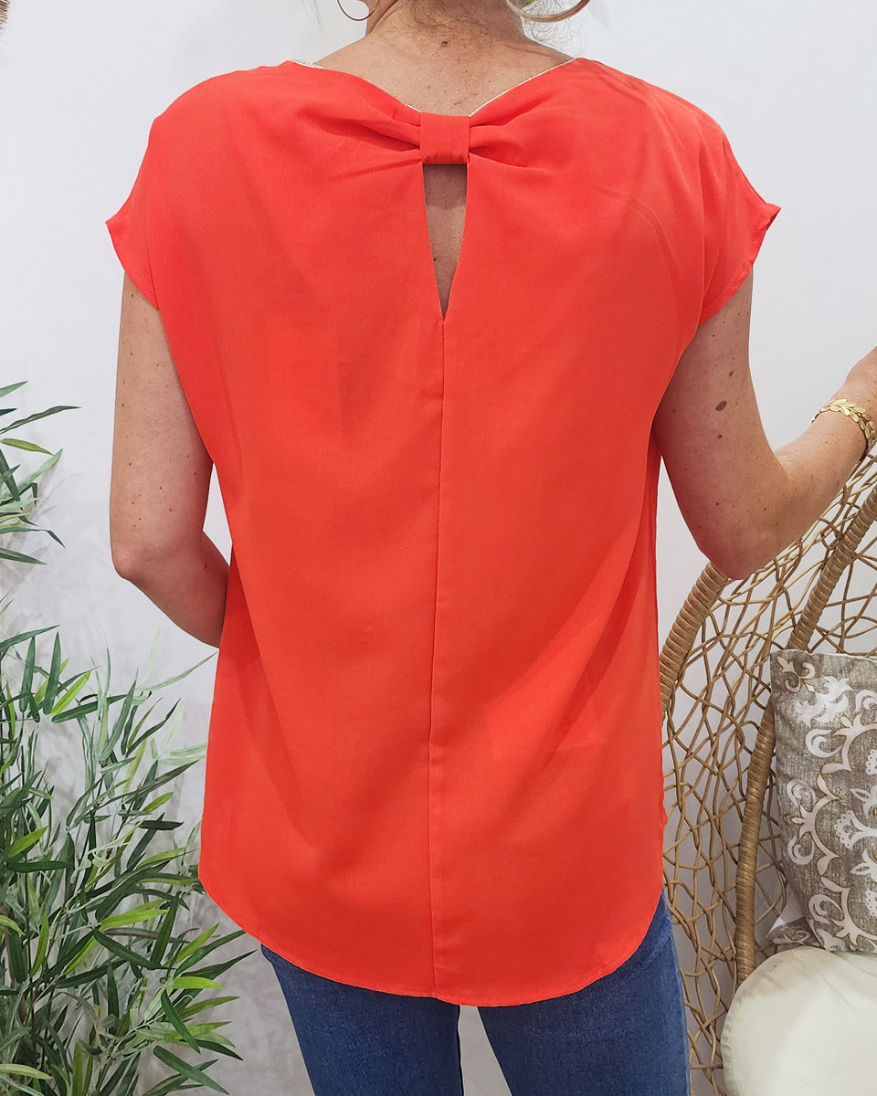 Blouse femme orange liseré doré dos noué