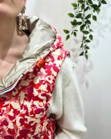 Doudoune femme sans manches dorée et motifs fuchsias orangés réversible