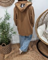 Manteau long femme à capuche étoile zébrée