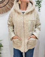 Manteau femme bouclettes manches et poche matelassées