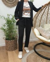 Pantalon femme fluide paper bag noir poches à volants
