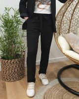 Pantalon femme fluide paper bag noir poches à volants