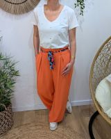 Pantalon fluide femme orange ruban à motifs
