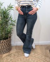 Jean femme flare taille haute à ourlet rapporté